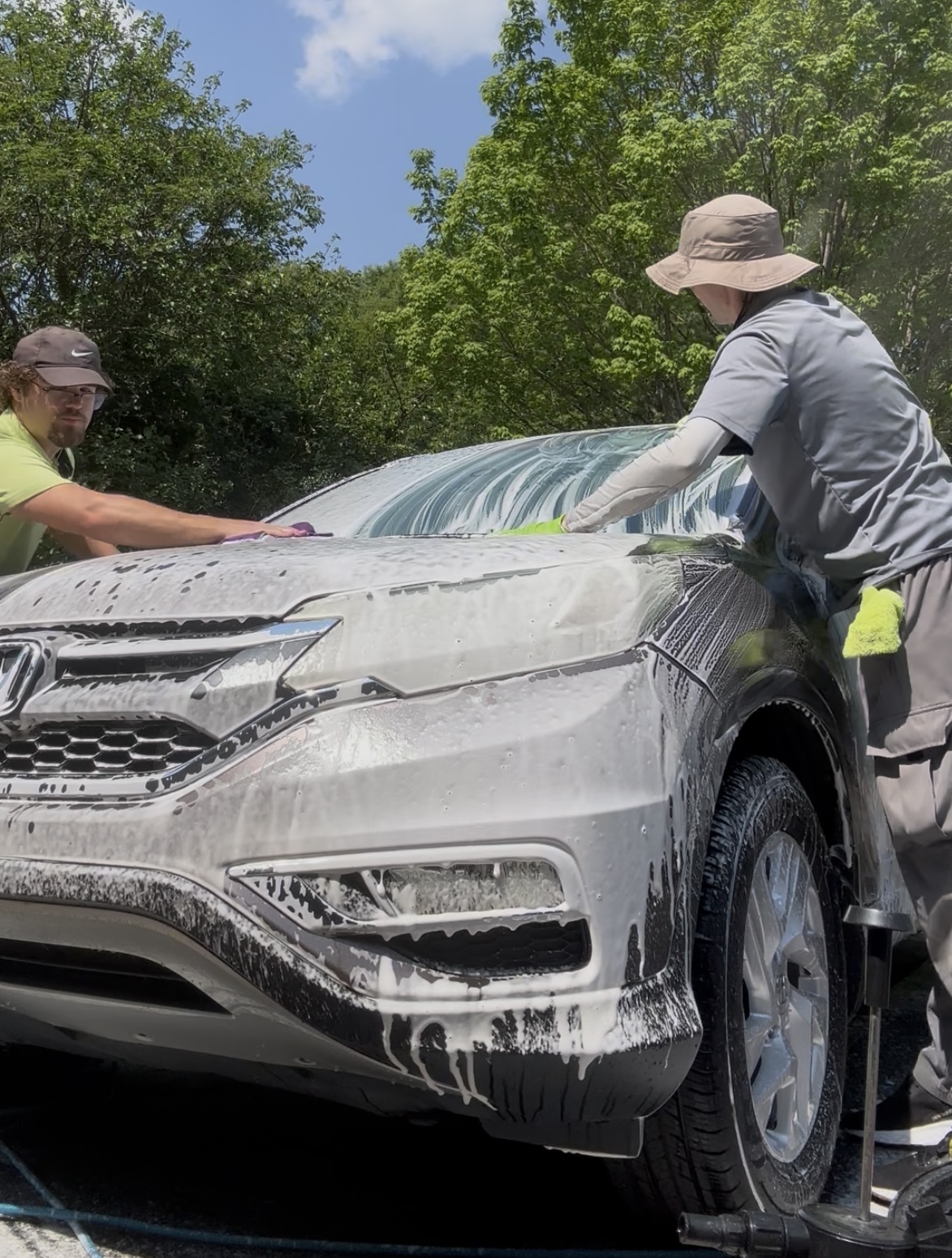Forever Fine Detailing team foam washing an SUV in the Upstate, SC